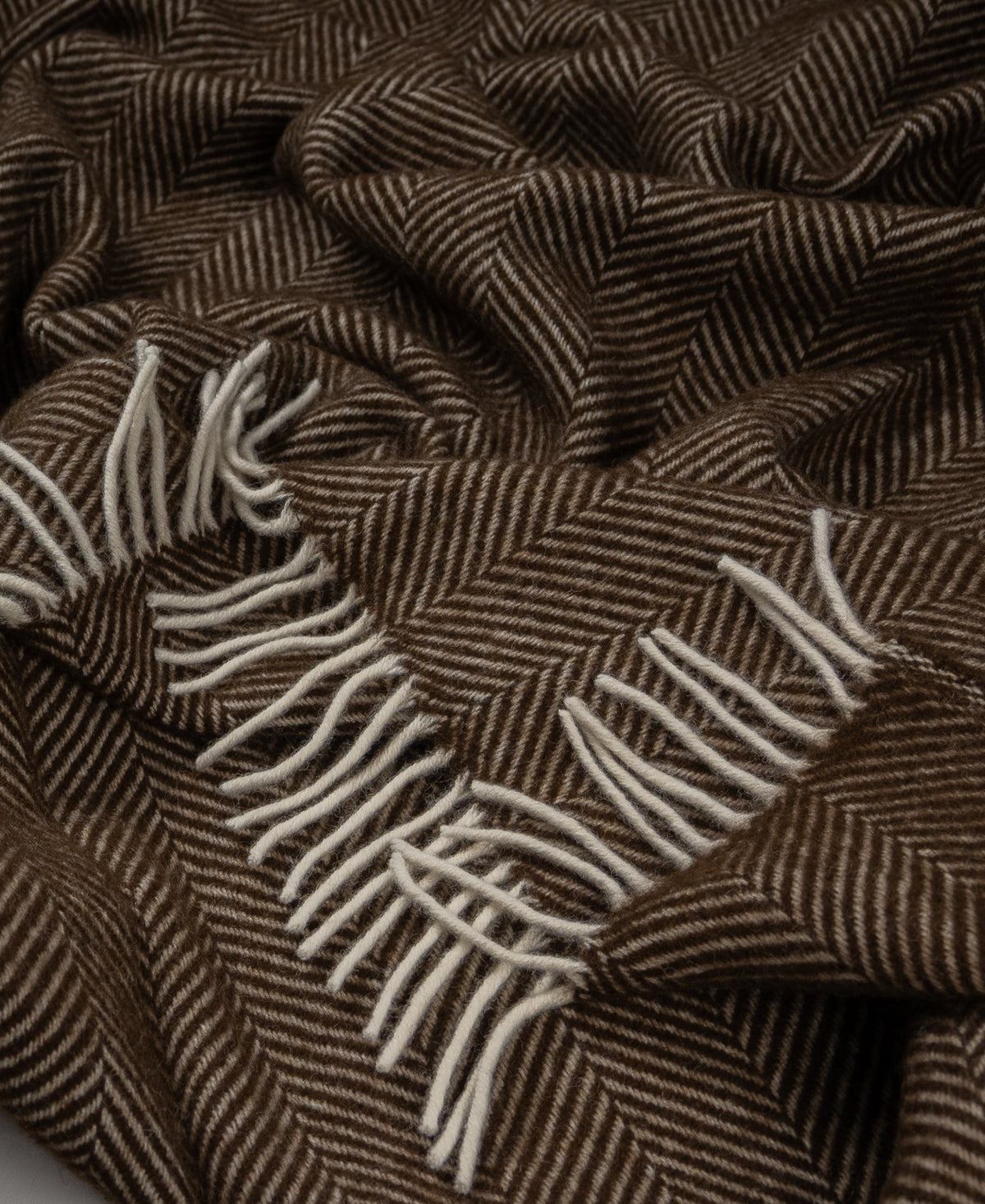 Brown and cream herringbone pure new wool throw with decorative fringe, woven in the British Isles.