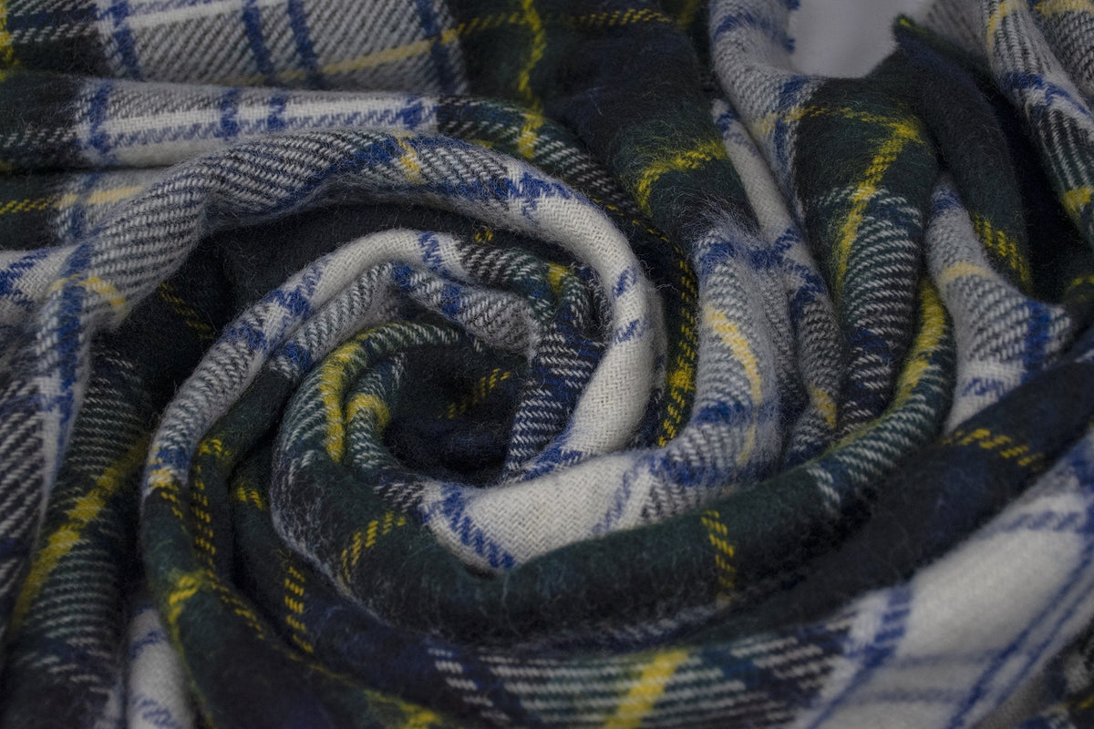 Dress Gordon tartan pure new wool throw blanket in a soft, coiled texture with green, white, blue, and yellow plaid.