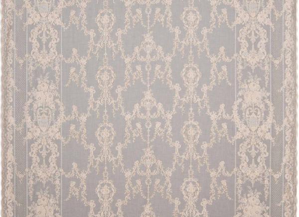 Gold sheer cotton curtain panel featuring an intricate, centuries-old woven damask pattern and scalloped edges.
