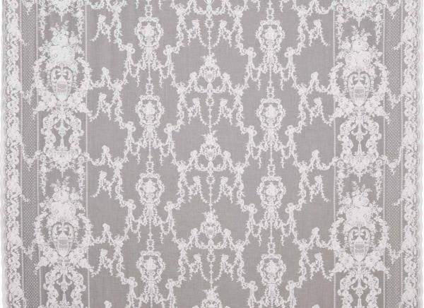 Ivory sheer cotton curtain panel with intricate neoclassical lace patterns and scalloped edges.
