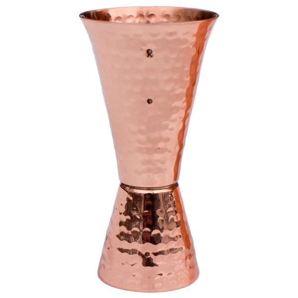 Double-sided hammered pure copper jigger with a polished finish for professional cocktail measuring.