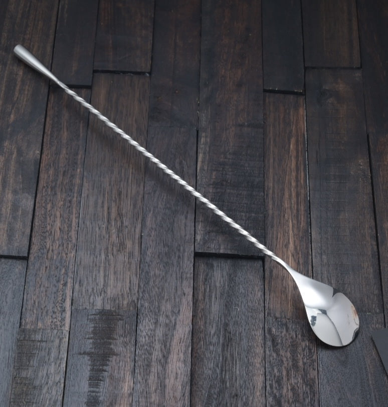 Polished stainless steel Japanese-style cocktail bar spoon with a long twisted handle and weighted teardrop end.
